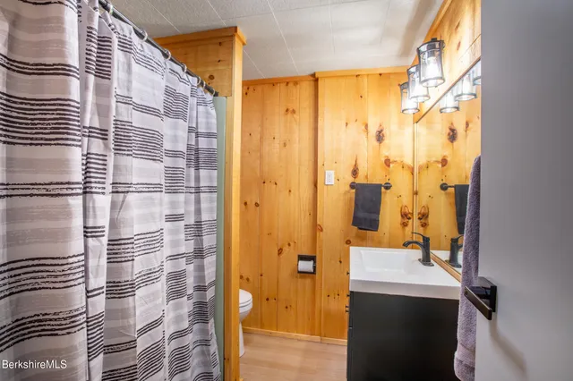 a bathroom with a shower and a sink