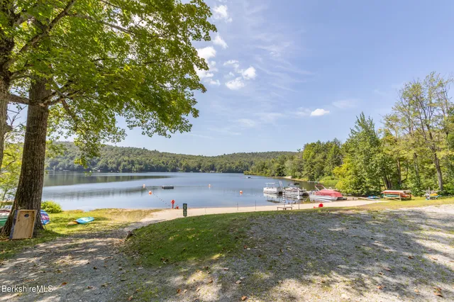 a view of a house with backyard and porch