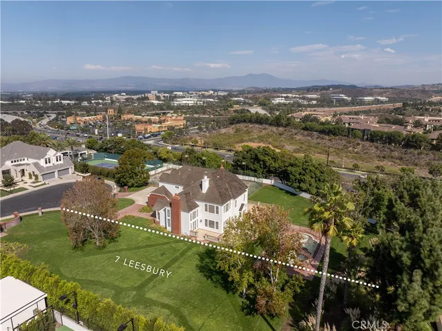an aerial view of a house with a garden