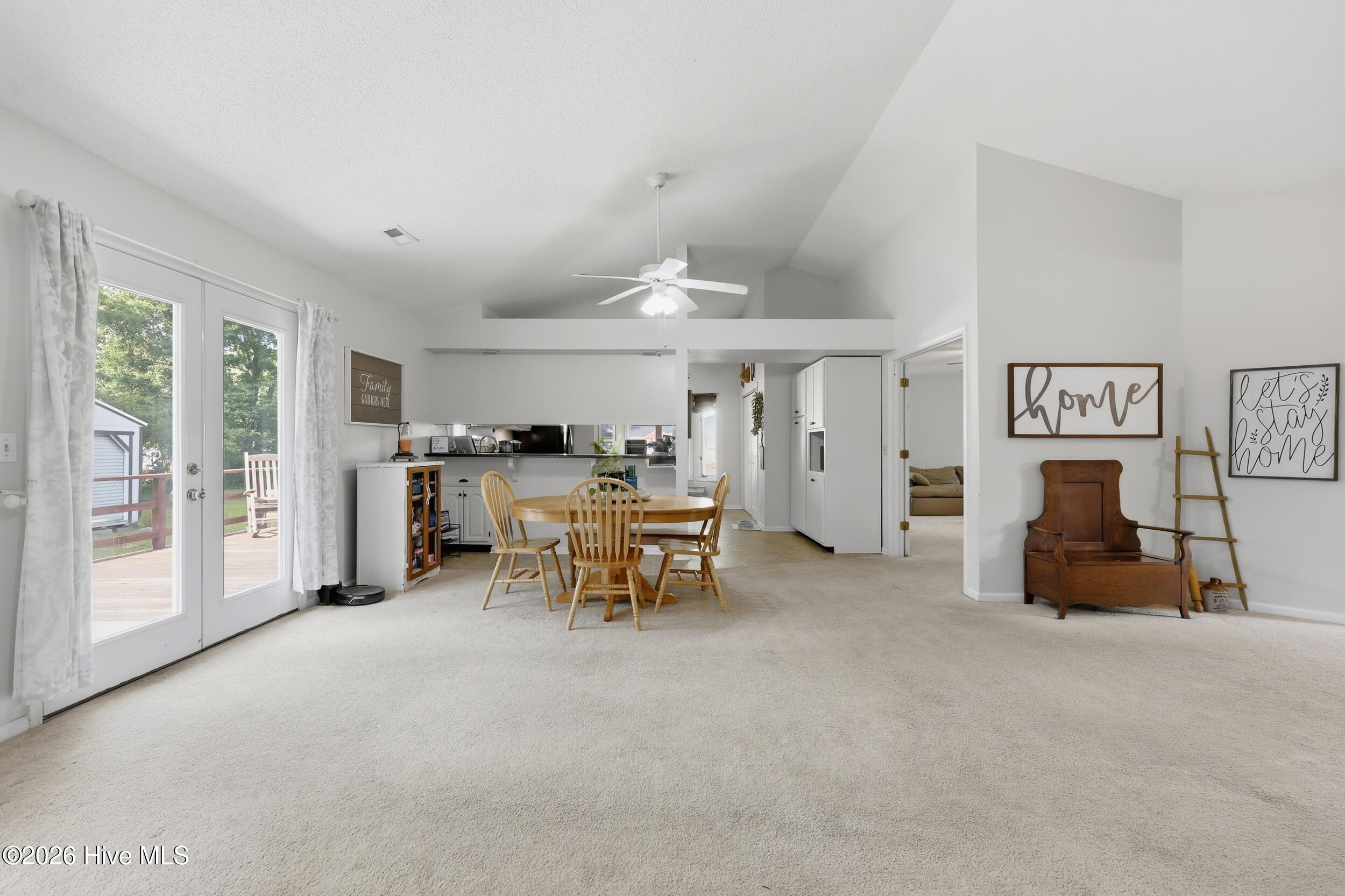 935 Soundside Road Edenton, NC 27932 - Photo 10 of 34 The open space offers vaulted ceilings, glass doors that lead to deck