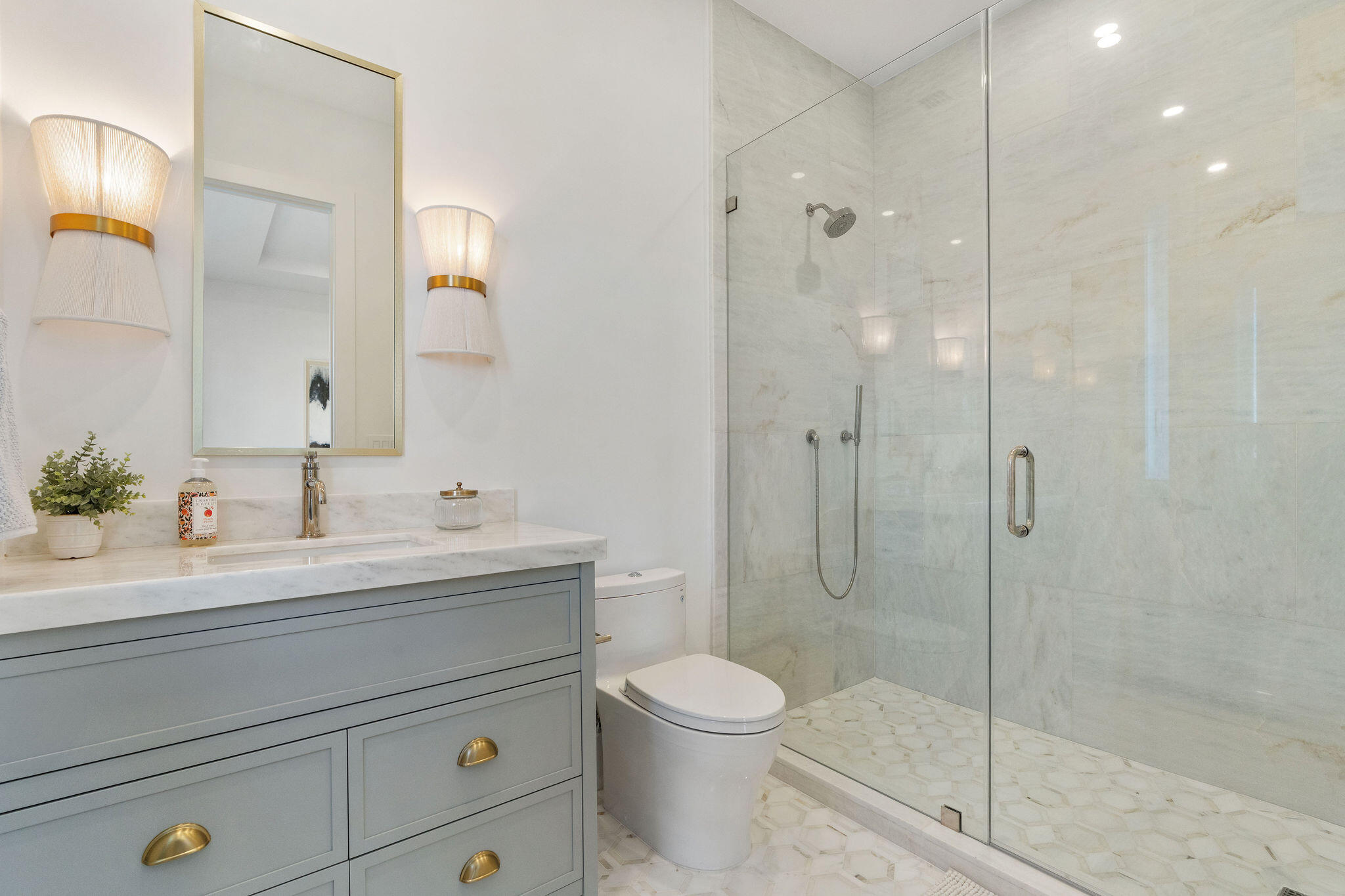 1002 Snapper Lane Key Largo, FL 33037 - Photo 38 of 106 a bathroom with a shower sink vanity mirror and toilet
