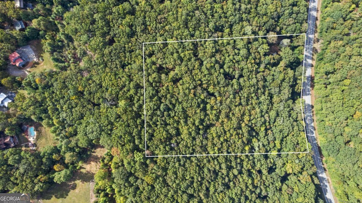 4092 Helen Highway Cleveland, GA 30528 - Photo 7 of 11 a backyard of a house with lots of green space and a fountain
