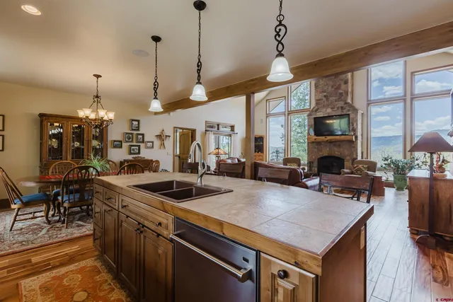a kitchen with sink stove and refrigerator