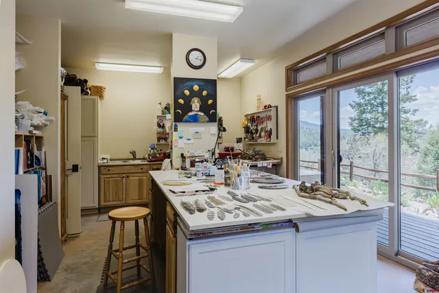 a kitchen with a sink a stove and a refrigerator
