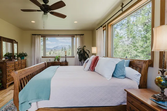 a bedroom with a bed and window