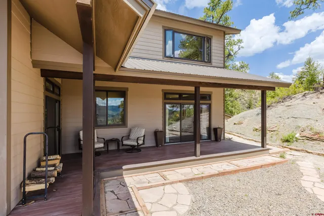 a view of a lobby with chair and floor to ceiling window