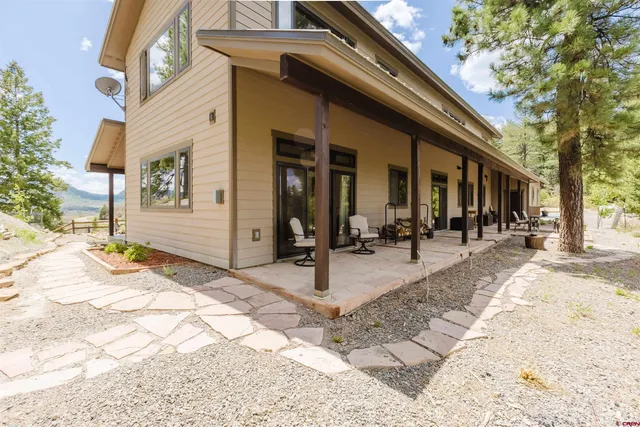 a view of a building with snow on the roadside