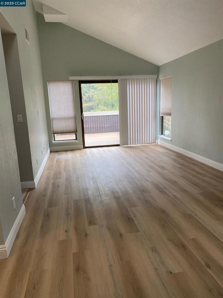 1544 Bailey Road Concord, CA 94521 - Photo 5 of 18 wooden floor in an empty room with a window