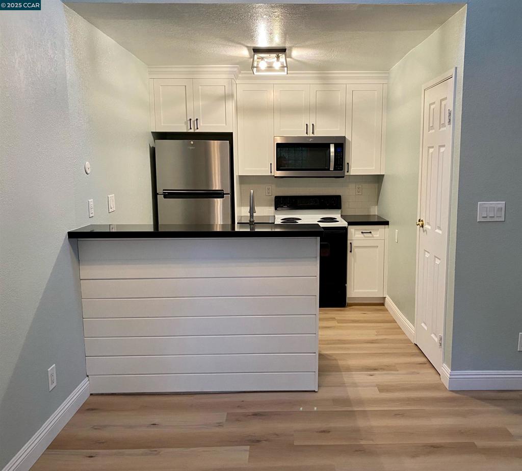 1544 Bailey Road Concord, CA 94521 - Photo 6 of 18 a view of a kitchen with electric appliances