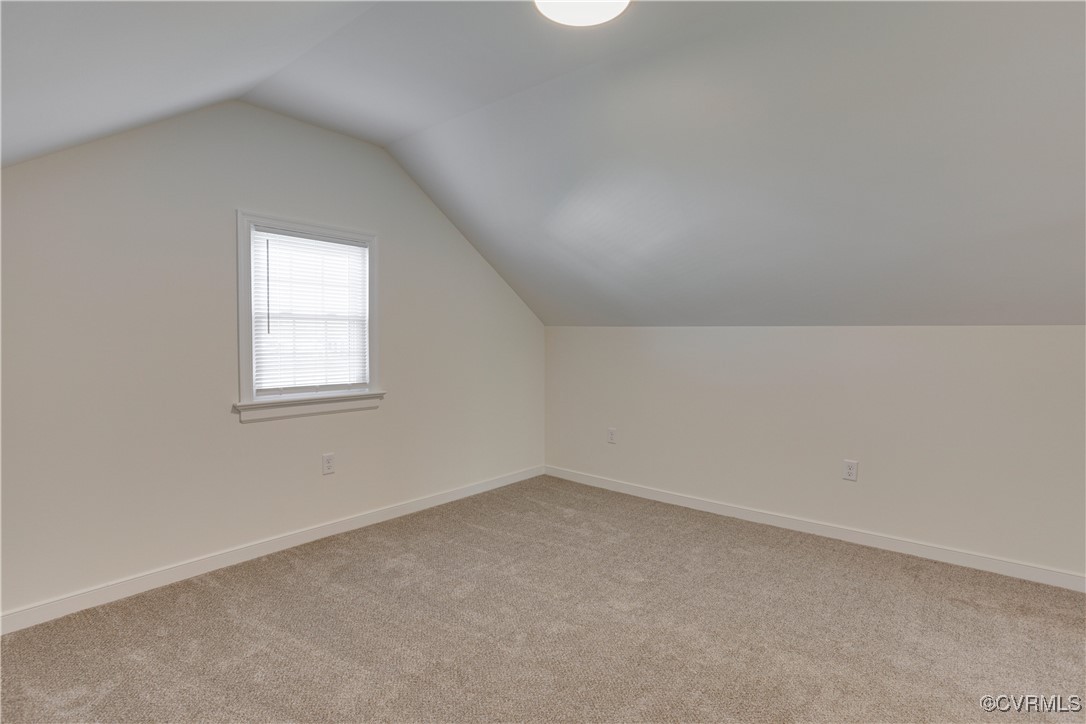 6116 Staples Mill Road Henrico, VA 23228 - Photo 12 of 24 Bonus room with light colored carpet and vaulted c