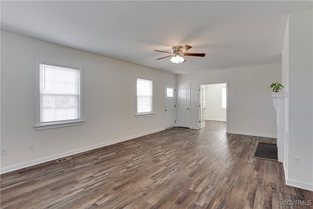 6116 Staples Mill Road Henrico, VA 23228 - Photo 6 of 24 Unfurnished living room featuring a fireplace, dar
