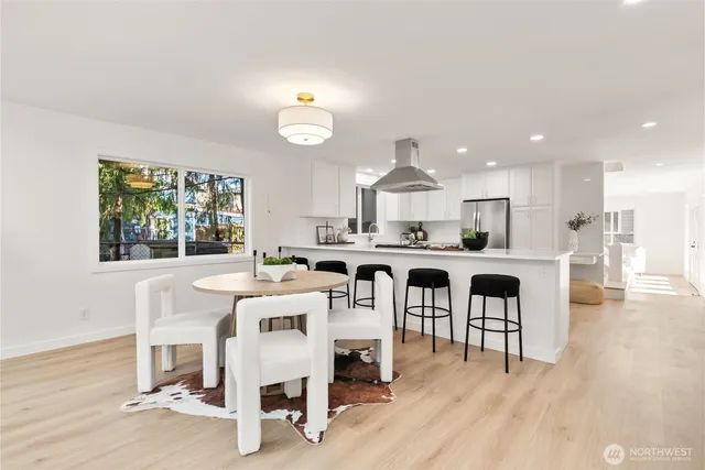 a kitchen with a refrigerator and a sink