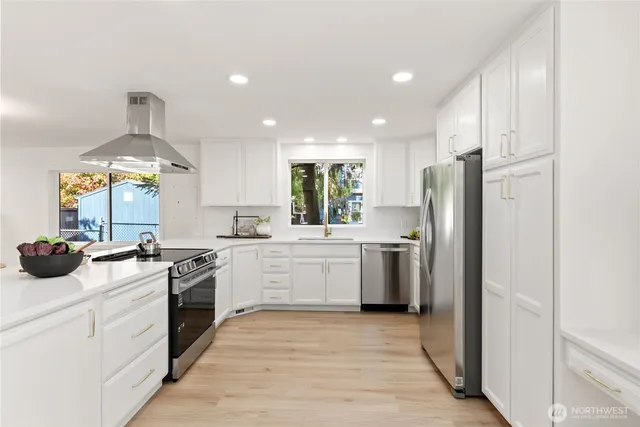 a kitchen with a stove and cabinets