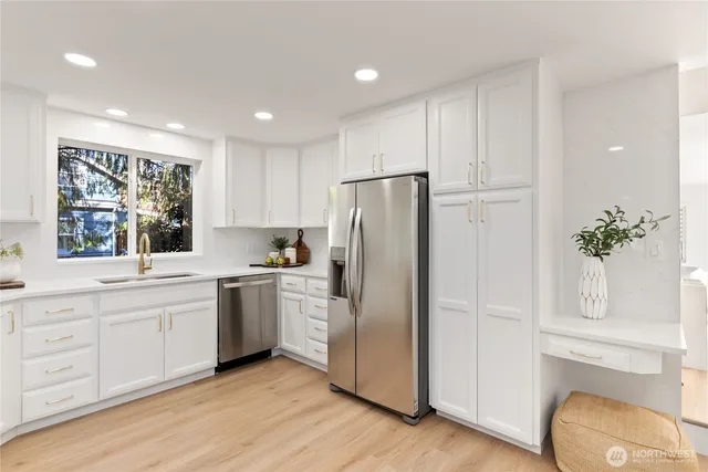 a living room with furniture kitchen and a table