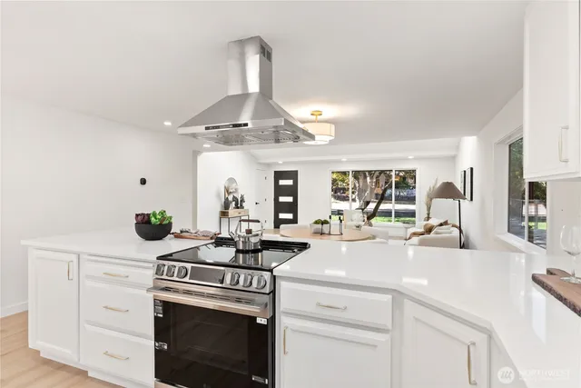 a view of a livingroom with furniture and wooden floor