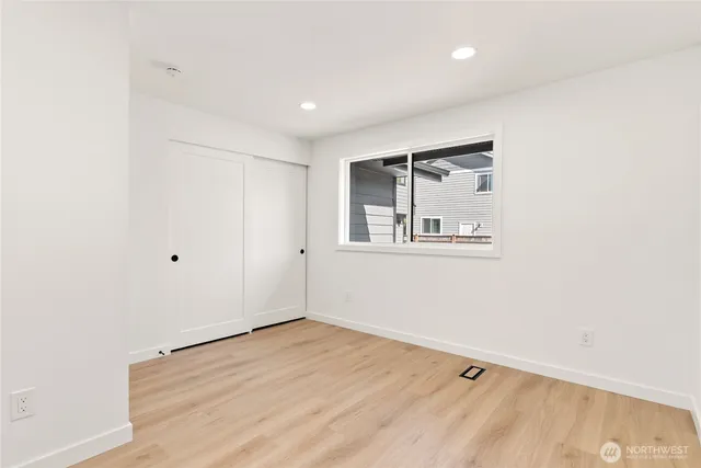 a bathroom with a double vanity sink toilet and shower
