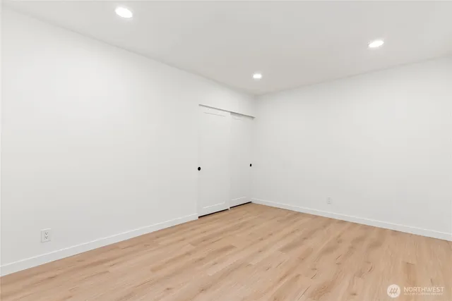 a front view of a house with a garden and yard