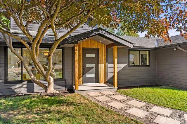 a living room with furniture and large window