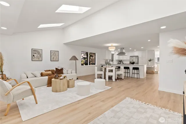 a view of a kitchen with dining table and chairs