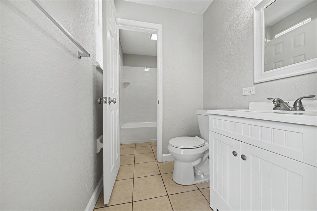 1109 Inland Street Leesburg, FL 34748 - Photo 11 of 15 a bathroom with a sink toilet and shower