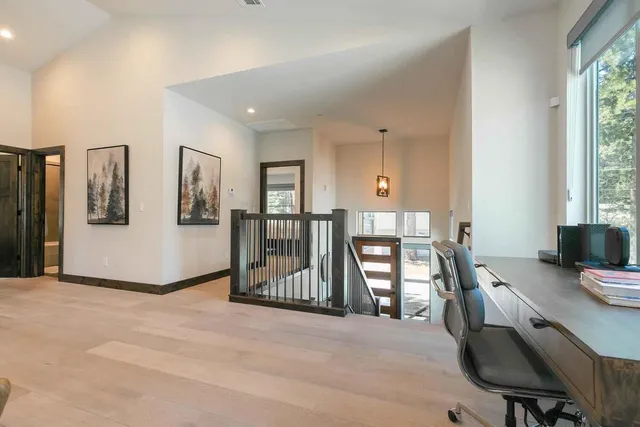 a view of a livingroom with furniture and staircase