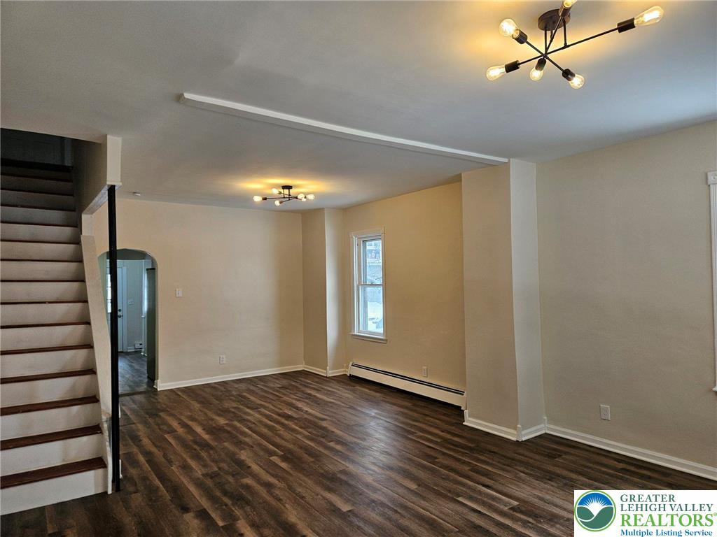 321 Washington Street Walnutport, PA 18088 - Photo 2 of 14 a view of empty room with wooden floor and fan