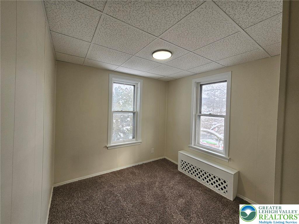 321 Washington Street Walnutport, PA 18088 - Photo 9 of 14 an empty room with windows