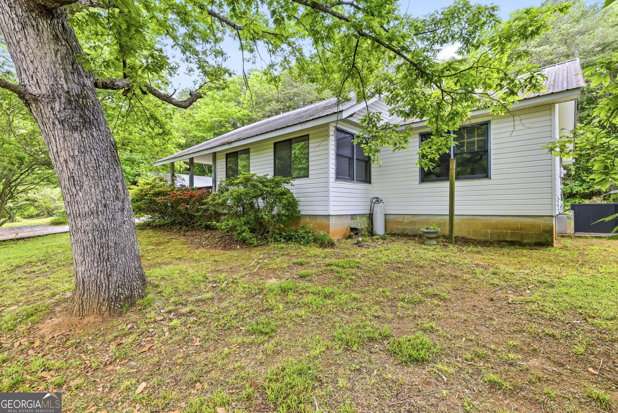 210 Kentucky Street Demorest, GA 30535 - Photo 2 of 30 a house that has a tree in front of the house