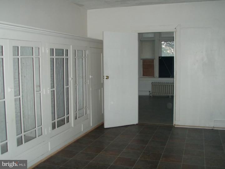 1406 Schuylkill Avenue Reading, PA 19601 - Photo 2 of 8 a view of a hallway with wooden shelves