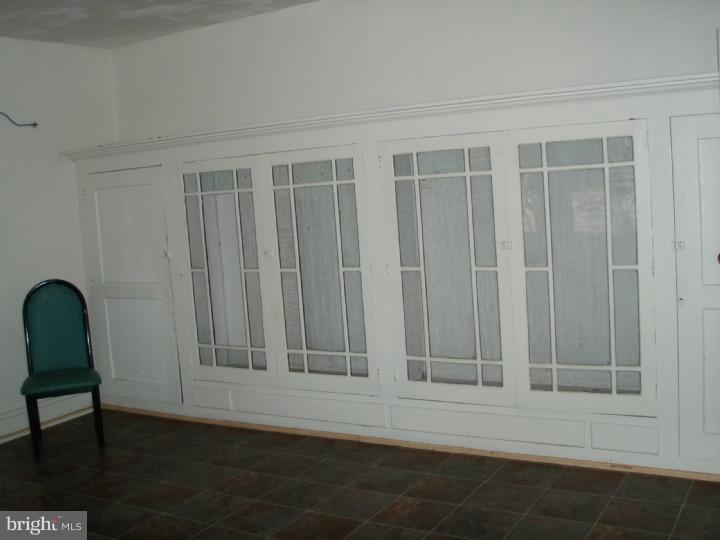 1406 Schuylkill Avenue Reading, PA 19601 - Photo 7 of 8 a view of wooden door and chairs in a room