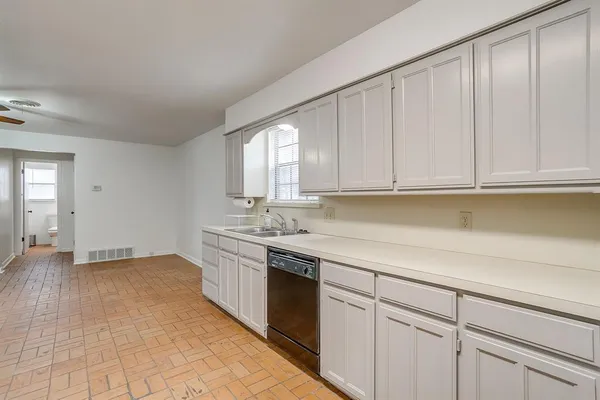 a kitchen with a stove and a microwave