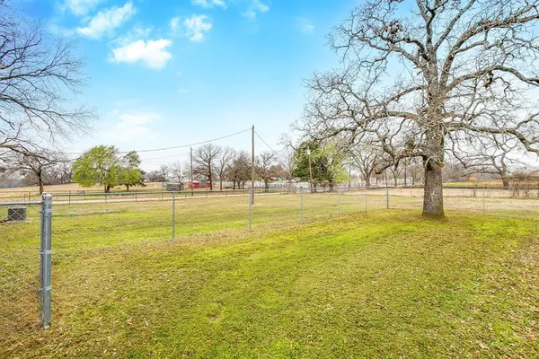 a view of a kitchen with cabinet and a stove top oven