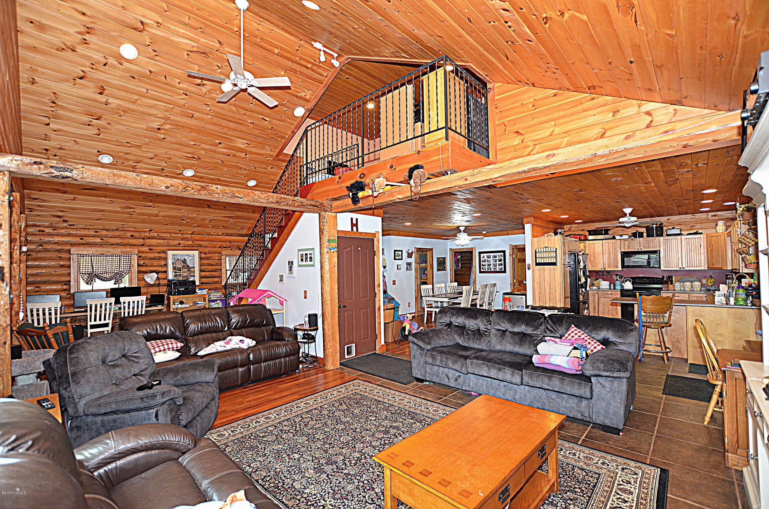 68 Cross Place Road Washington, MA 01223 - Photo 12 of 38 a living room with lots of furniture and a rug