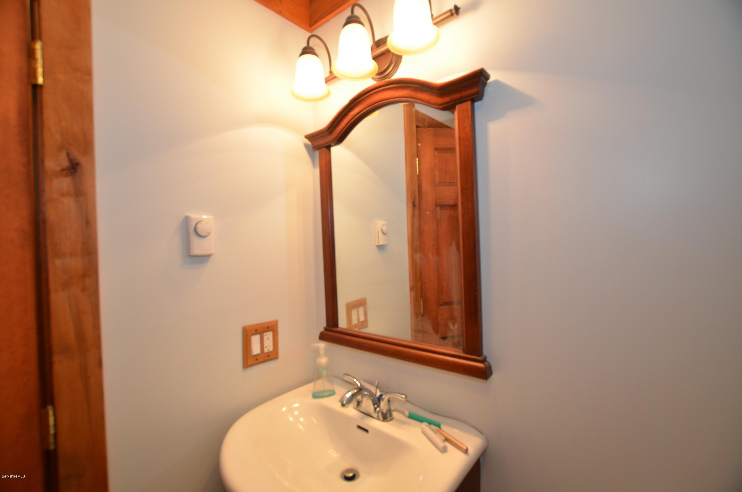 68 Cross Place Road Washington, MA 01223 - Photo 30 of 38 a bathroom with a sink and a mirror