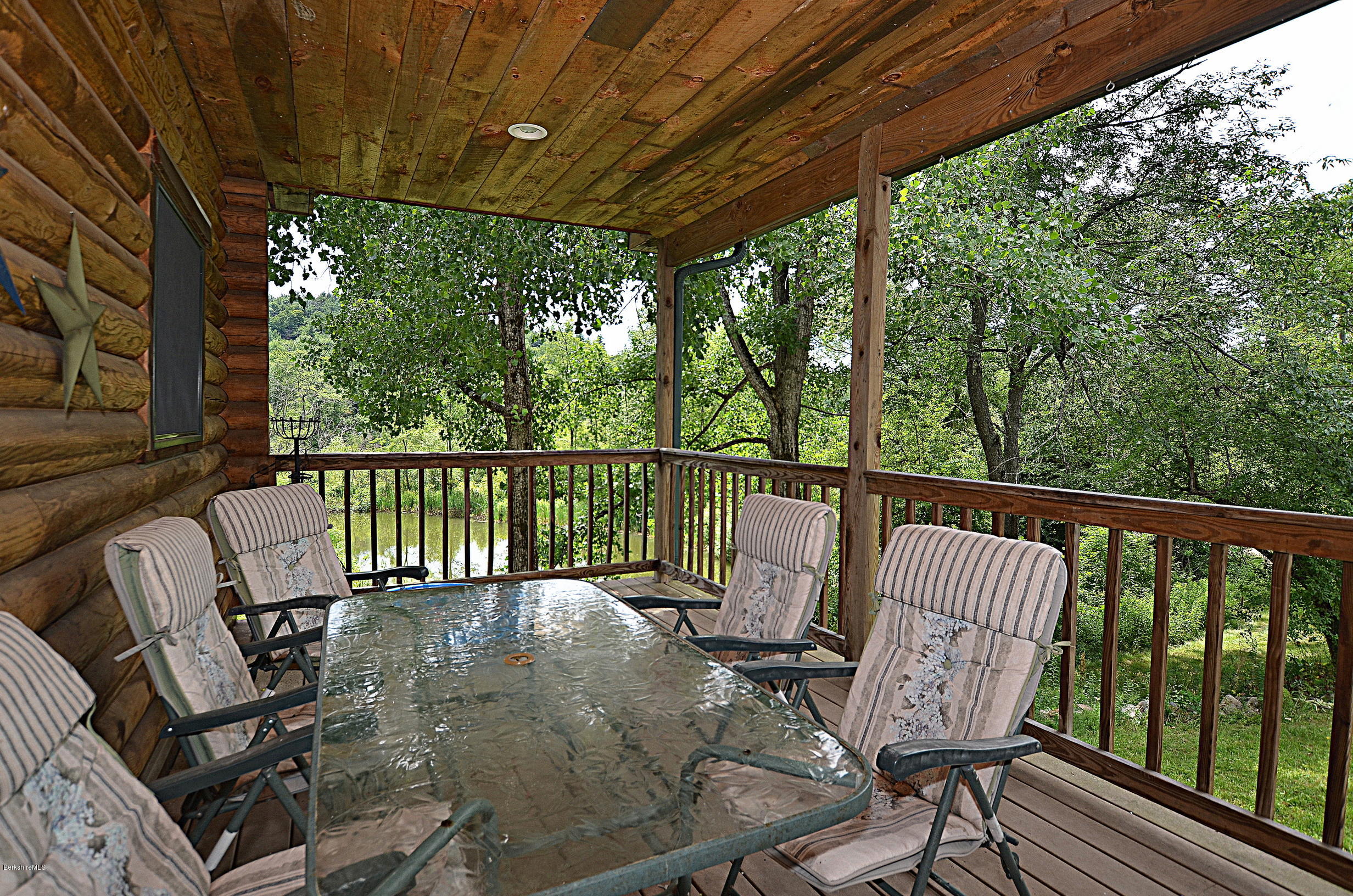 68 Cross Place Road Washington, MA 01223 - Photo 4 of 38 a view of a chair in wooden deck