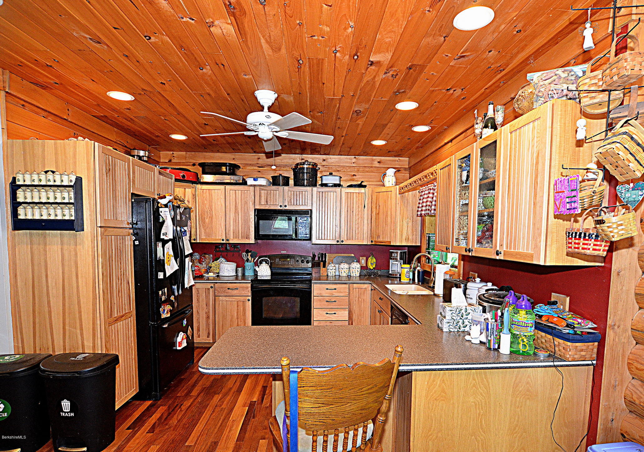 68 Cross Place Road Washington, MA 01223 - Photo 9 of 38 a kitchen with stainless steel appliances kitchen island granite countertop a sink dishwasher and a microwave with wooden floor