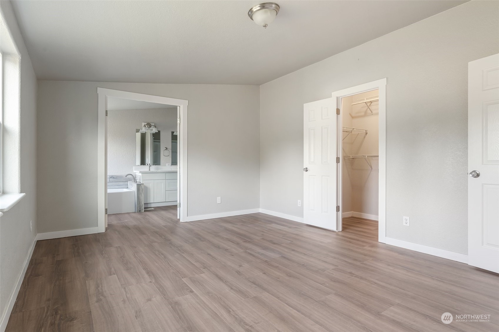 18740 Ivan Street Southwest Rochester, WA 98579 - Photo 16 of 39 a view of a room with wooden floor and a sink