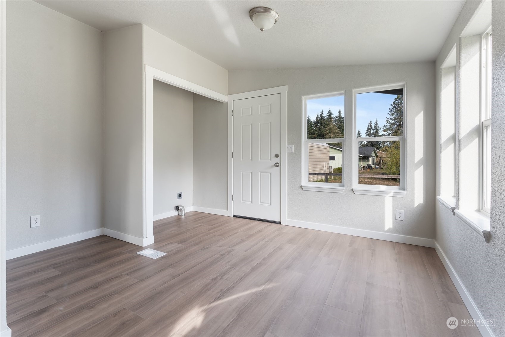 18740 Ivan Street Southwest Rochester, WA 98579 - Photo 23 of 39 wooden floor in an empty room with a window