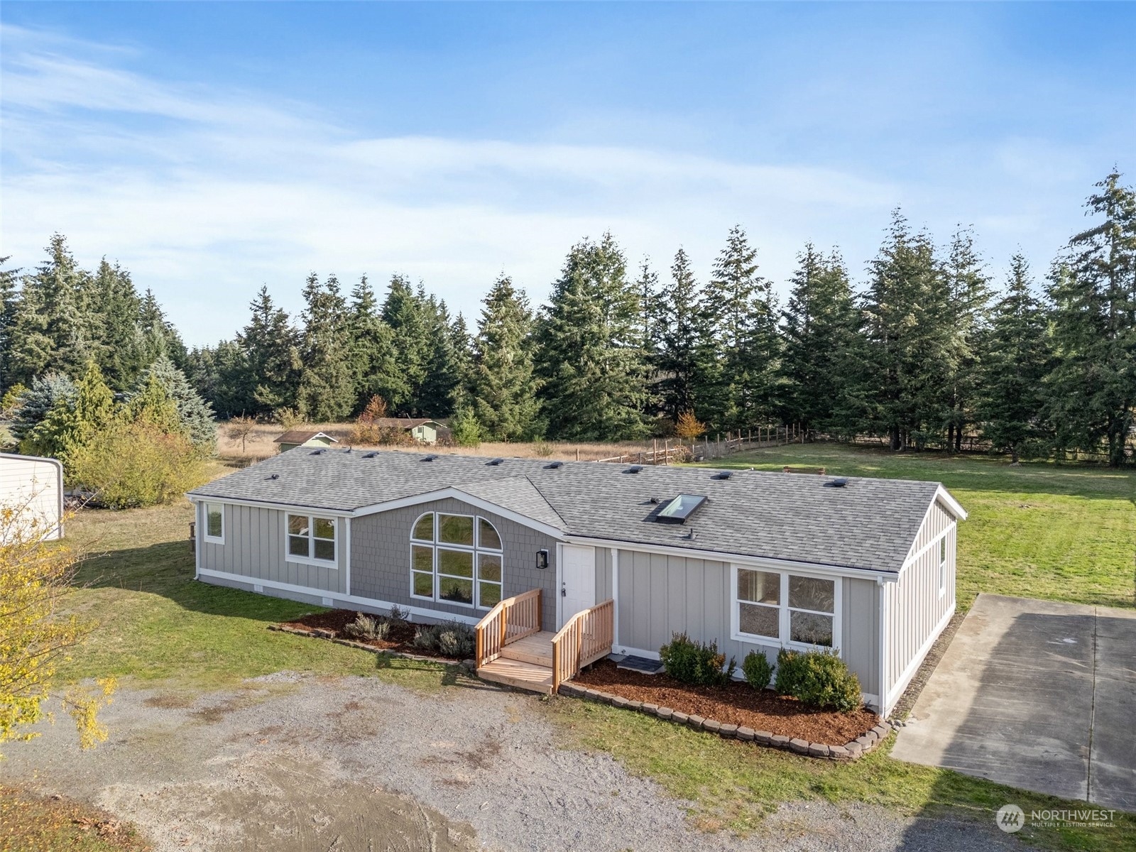18740 Ivan Street Southwest Rochester, WA 98579 - Photo 25 of 39 an aerial view of a house next to a yard