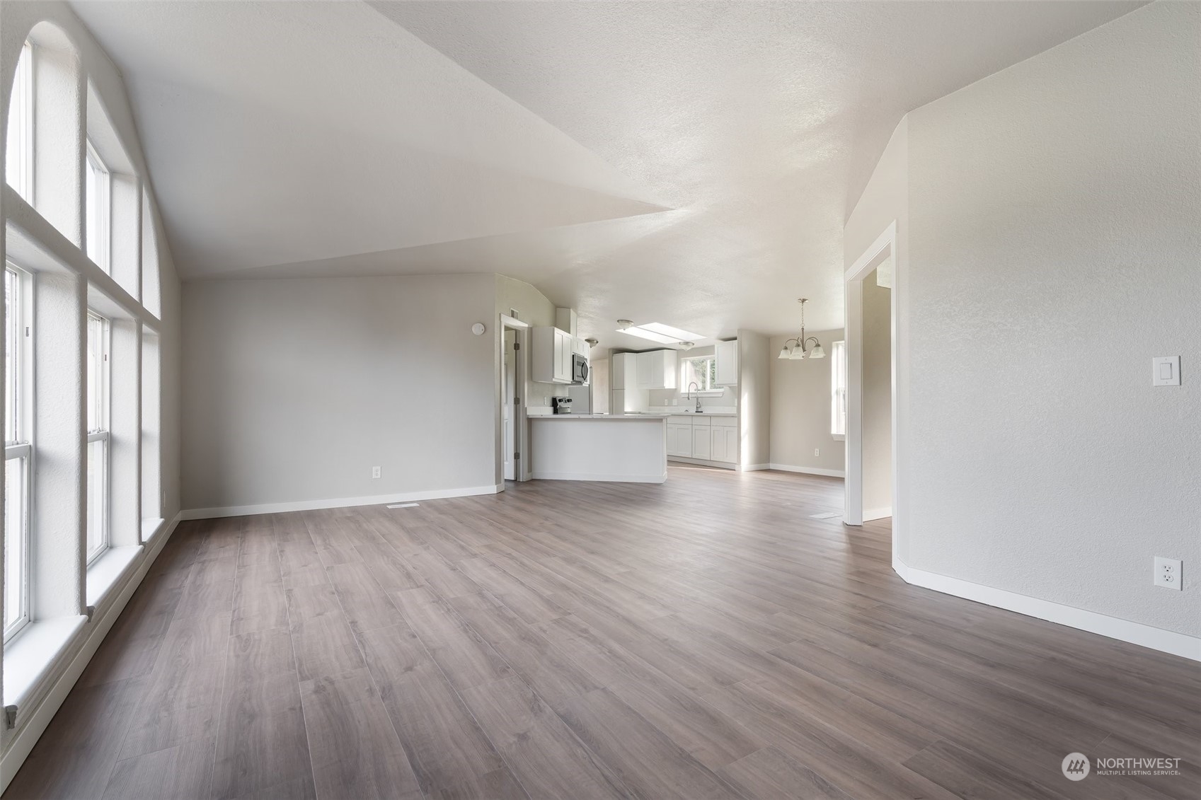 18740 Ivan Street Southwest Rochester, WA 98579 - Photo 3 of 39 wooden floor in an empty room with a window