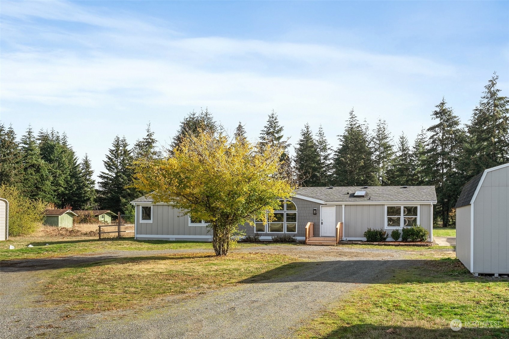 18740 Ivan Street Southwest Rochester, WA 98579 - Photo 38 of 39 a front view of a house with a yard and trees