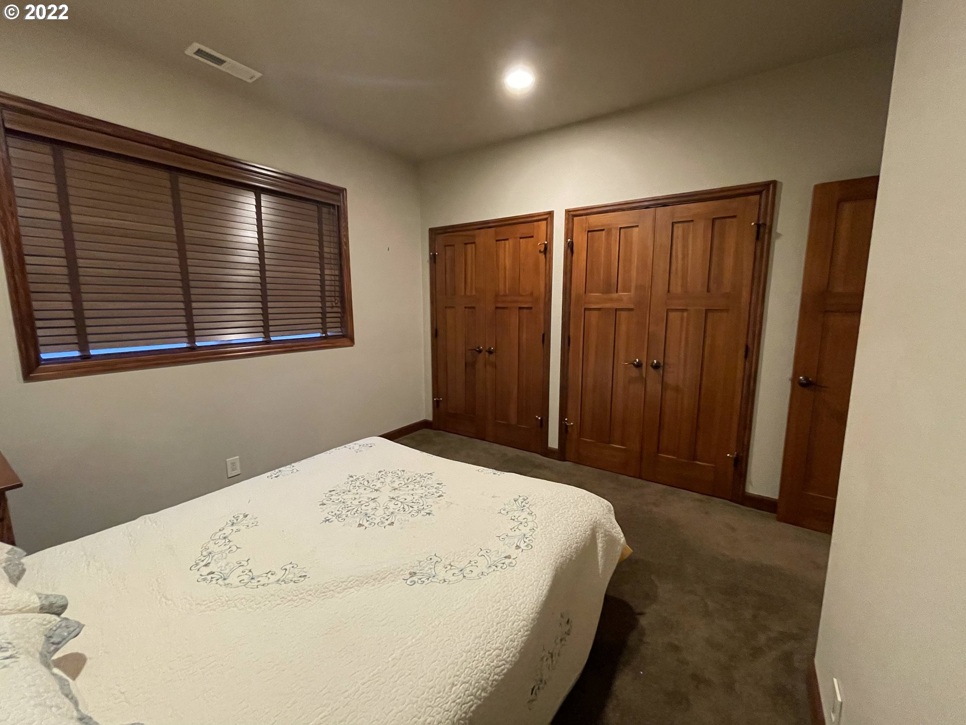 3247 Lake Crest Drive Eugene, OR 97408 - Photo 22 of 31 a bed sitting in a spacious bathroom next to a window