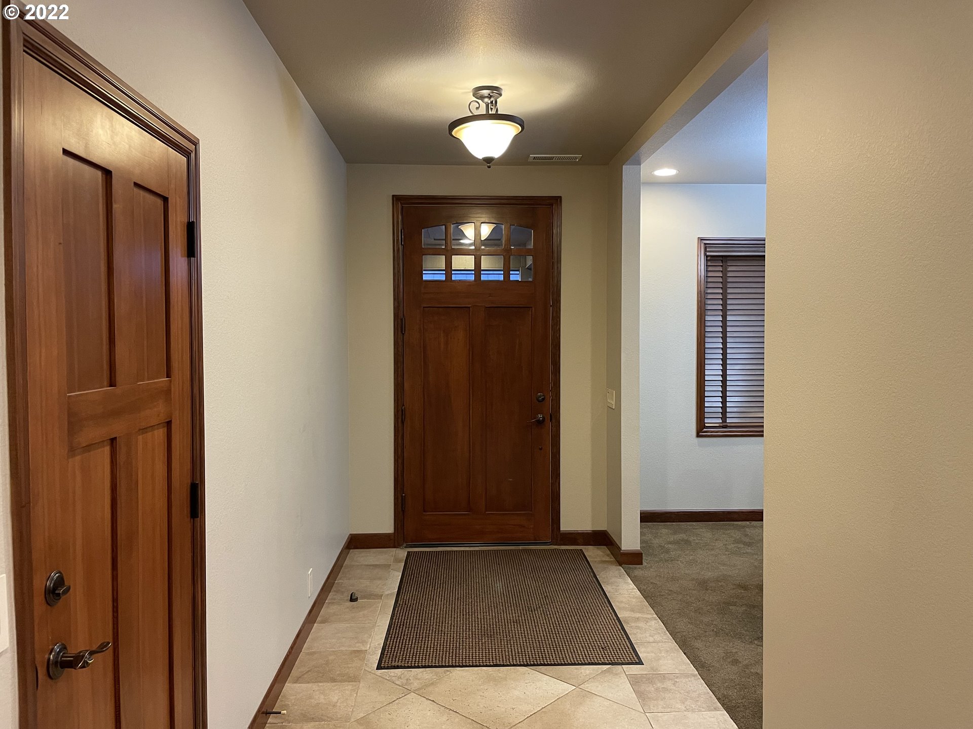 3247 Lake Crest Drive Eugene, OR 97408 - Photo 3 of 31 wooden floor in an empty room with a mirror