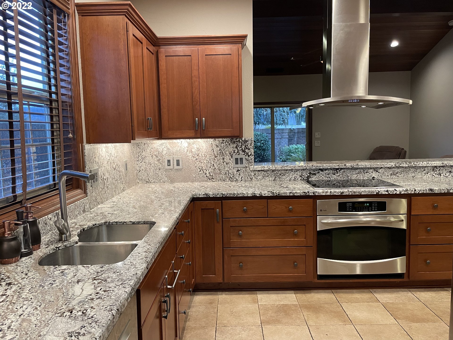3247 Lake Crest Drive Eugene, OR 97408 - Photo 7 of 31 a kitchen with a sink and a refrigerator