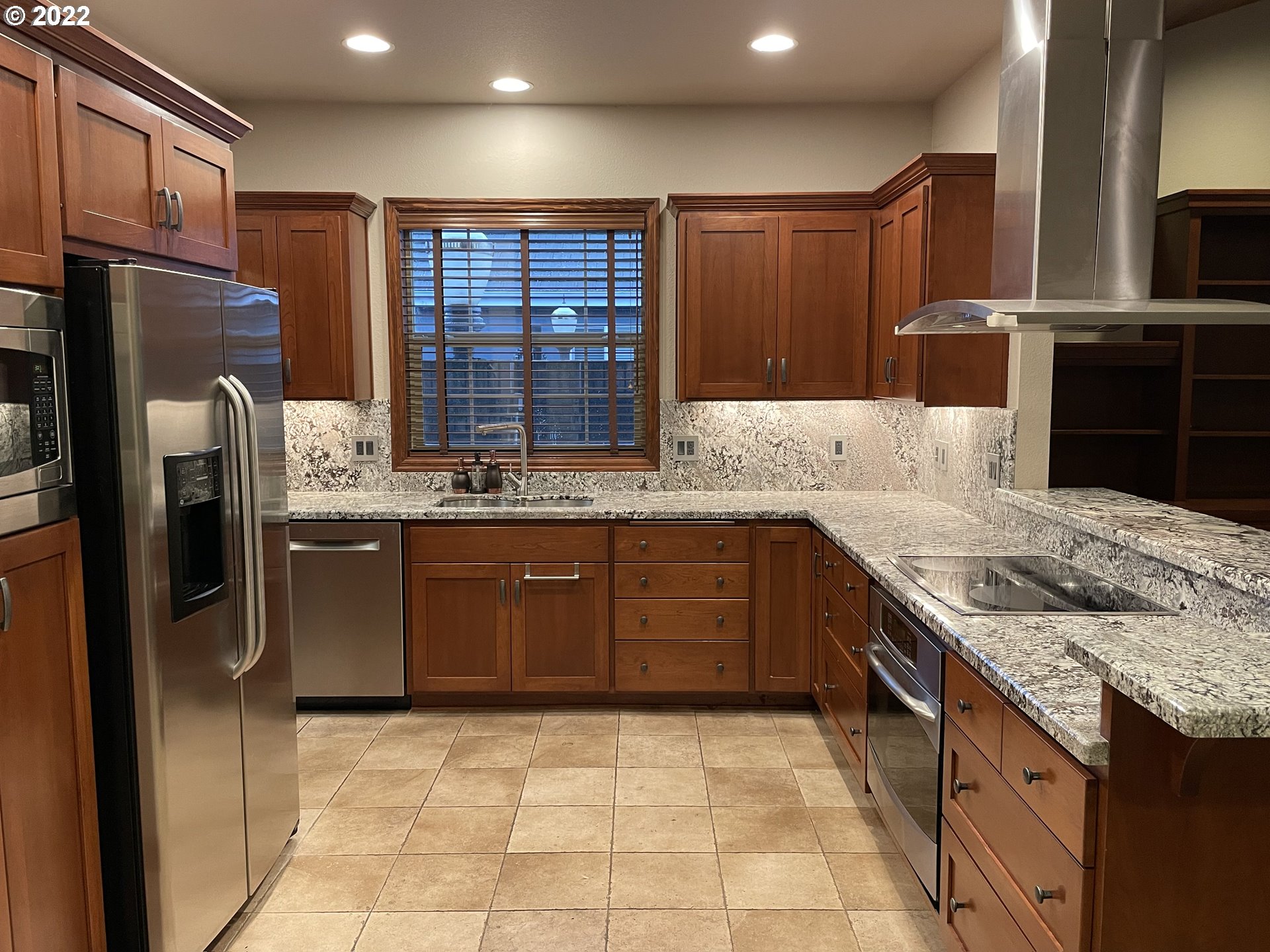 3247 Lake Crest Drive Eugene, OR 97408 - Photo 8 of 31 a kitchen with stainless steel appliances granite countertop a refrigerator and a sink