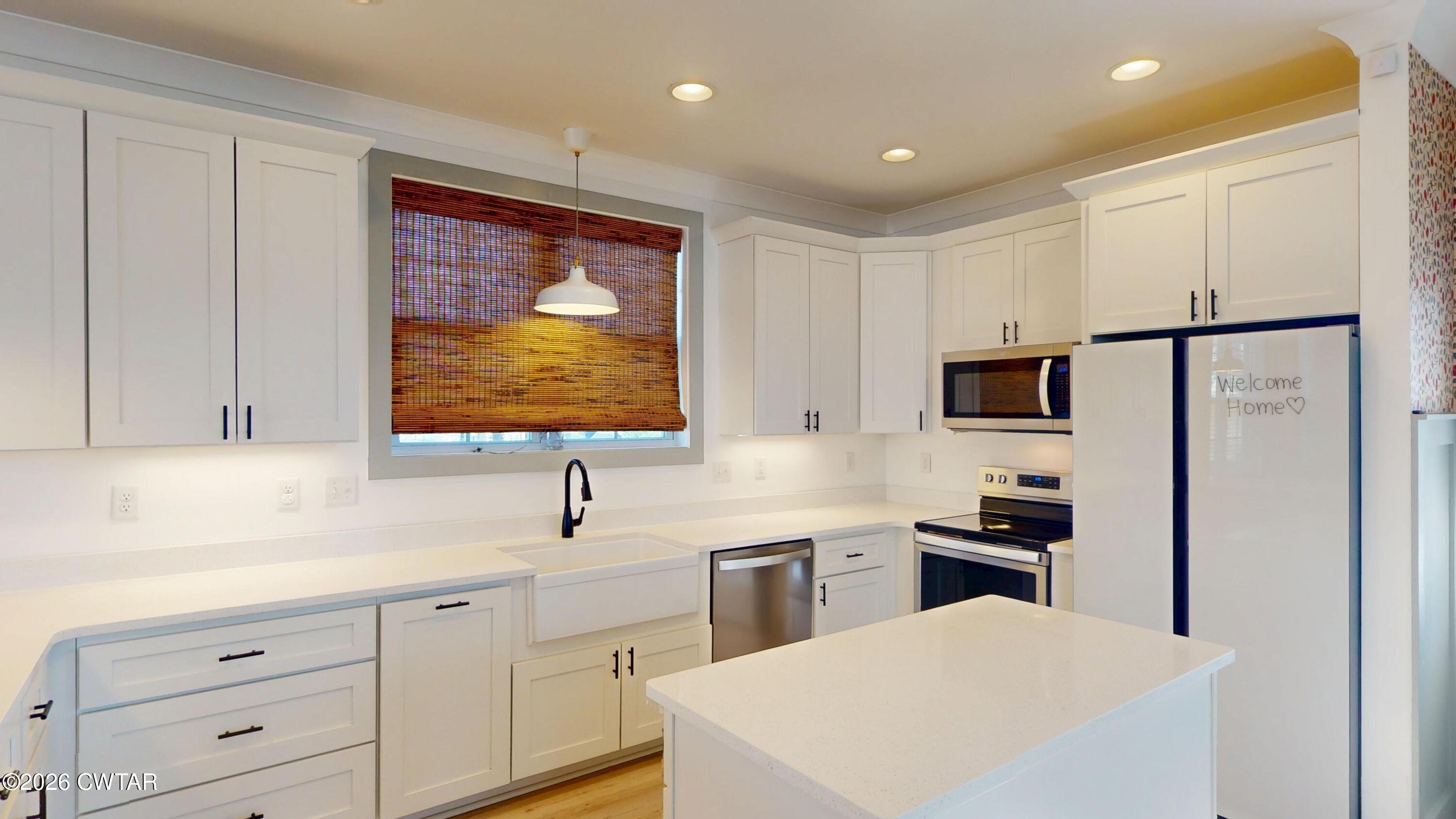 226 Morgan Street Jackson, TN 38301 - Photo 14 of 51 a kitchen with stainless steel appliances a refrigerator sink and cabinets