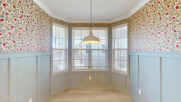 a bathroom with a bathtub and window