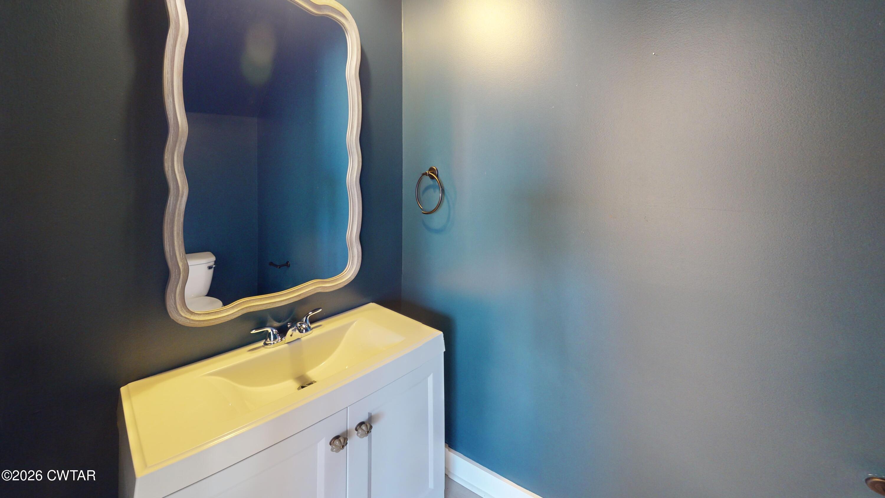 226 Morgan Street Jackson, TN 38301 - Photo 19 of 51 a bathroom with a sink and a mirror