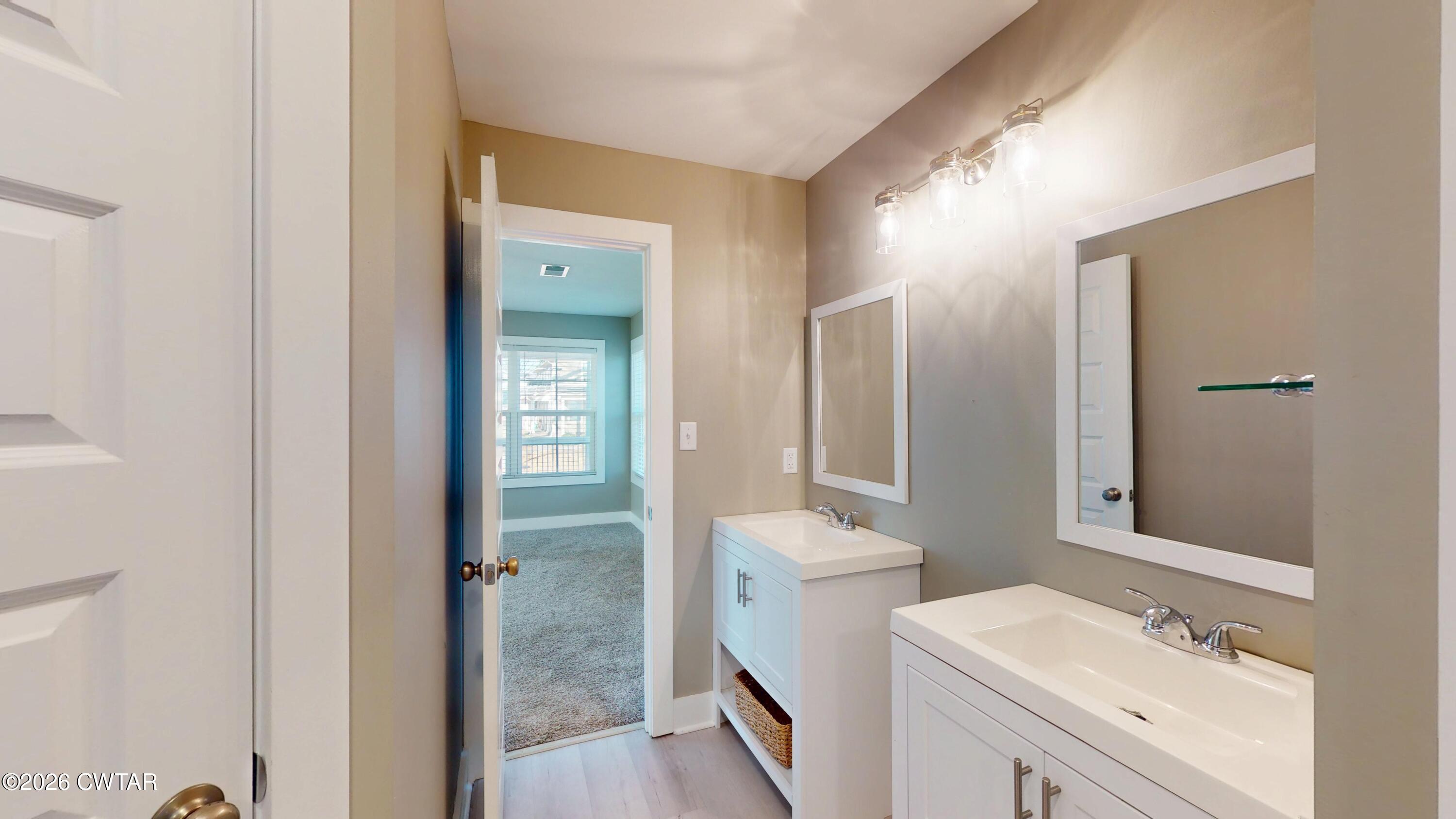 226 Morgan Street Jackson, TN 38301 - Photo 22 of 51 a bathroom with a sink and mirror with toilet
