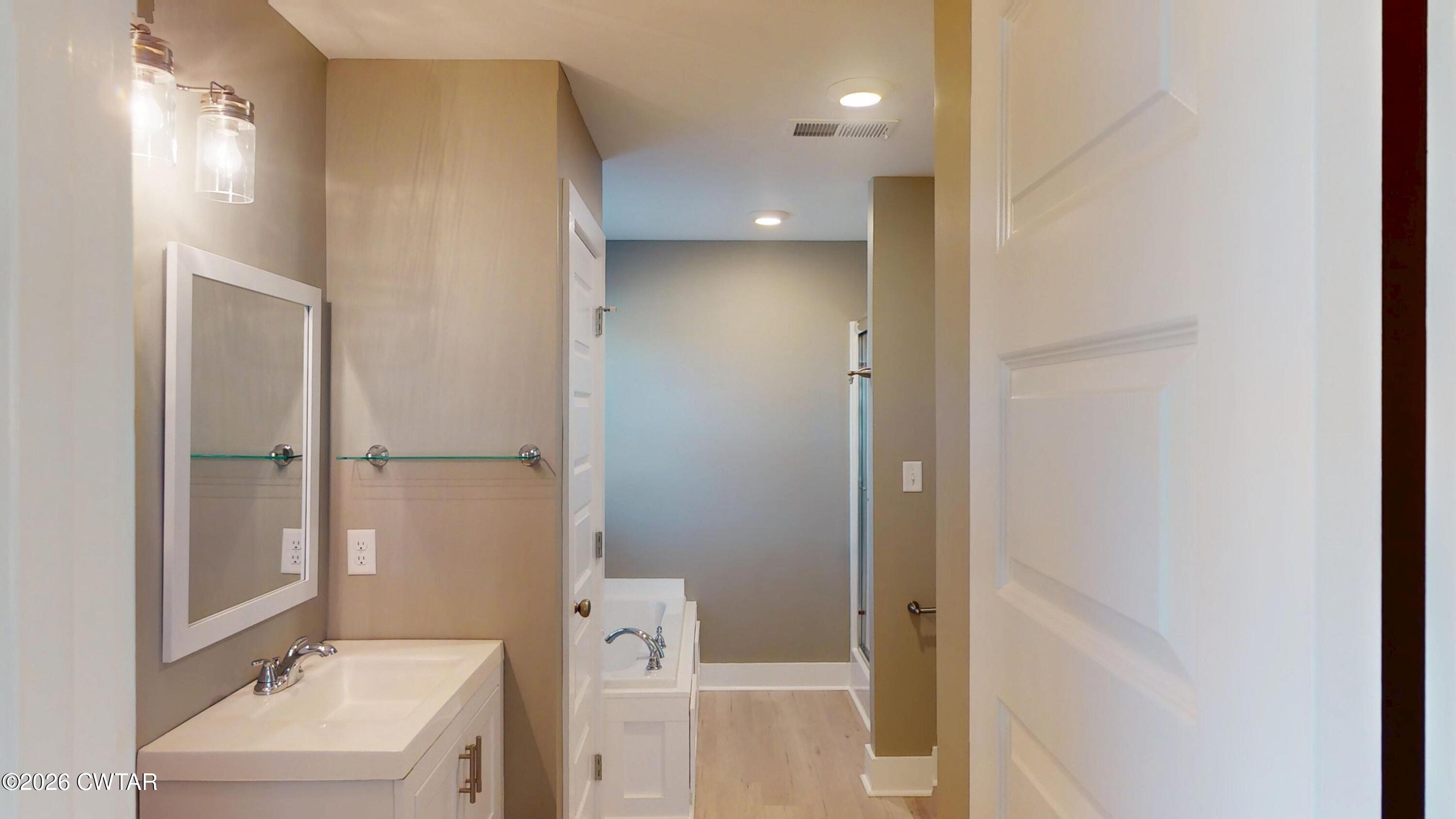 226 Morgan Street Jackson, TN 38301 - Photo 25 of 51 a bathroom with a sink and mirror